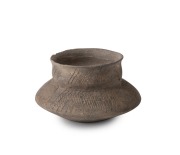 Ancient pottery vessel with incised decoration, unknown age and origin, 6cm high, 10cm wide.