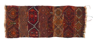 A tribal flat weave rug with red and blue ground with orange highlights, 215 x 85cm