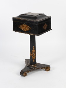 An antique English papier-m&acirc;ch&eacute; worktable with hand-painted and gilt decoration, interior has been transformed into a teapoy, early to mid 19th century, 75cm high, 37cm wide, 31cm deep