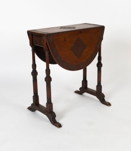An antique English walnut oval drop-leaf Sutherland table, the top with gum leaf carved banded edge and floral lozenge carved panels to the leaves, circa 1900, 67cm high, 61cm wide, 25cm deep (82cm extended)