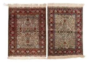 Two fine quality Qum hand-woven silk rugs, ​​​​​​​the larger 100 x 68cm overall.
