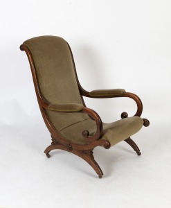 An antique English Regency easy chair, carved beech and green velvet, circa 1825, ​​​​​​​95cm high, 60cm across the arms.