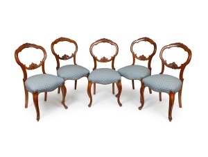 A set of five antique English carved walnut dining chairs with blue upholstery, 19th century