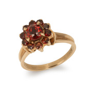 A vintage 9ct gold and garnet cluster ring, 20th century, stamped "9ct", ​​​​​​​3.9 grams.