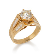 An 18ct gold ring, set with an approximately 1ct brilliant cut diamond flanked by six diamonds on each shoulder, 20th century, 6.3 grams