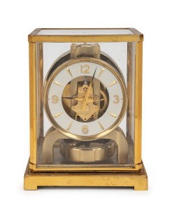 JAEGER LECOULTRE "Atmos" Swiss made clock in original brass lacquered four glass case, skeletonised movement with Arabic and baton hour mark chapter ring, circa 1950, with original manufacturer's "Repair Notes" handbook, 22.5cm high, 18cm high, 13.5cm deep