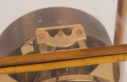 JAEGER LECOULTRE "Atmos" Swiss made clock in original brass lacquered four glass case, skeletonised movement with Arabic and baton hour&nbsp;mark chapter ring, circa 1950, with original manufacturer's "Repair Notes" handbook, 22.5cm high, 18cm high, 13.5cm dee - 2