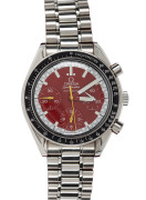 OMEGA "Speedmaster" gents automatic wristwatch with red dial and three subsidiary dials, in stainless steel case with original buckle and bracelet, housed in an Omega box, 4.1cm wide including crown