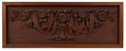 An Australian Arts & Crafts panel, carved silky oak in the form of gumnuts, blossoms and branches, early 20th century, ​​​​​​​24 x 61.5cm overall