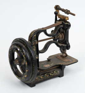 An antique miniature sewing machine, 19th century, ​​​​​​​20cm high