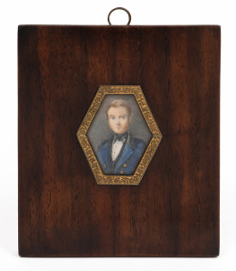 A miniature portrait of a gentleman in a blue overcoat, hand-painted on ivory in hexagonal gilt metal mount and timber frame, 19th century, 11.5 x 10cm