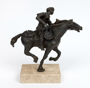 In the style of FREDERIC REMINGTON cast bronze statue of a horse and rider, late 20th century, 23cm high overall.