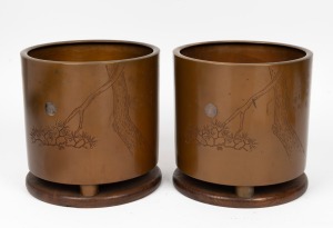 A pair of Japanese bronze planter jardinieres, inlaid with silver moons and engraved poem, both standing on elm fitted bases, mid 20th century, each 24cm high, 24cm diameter