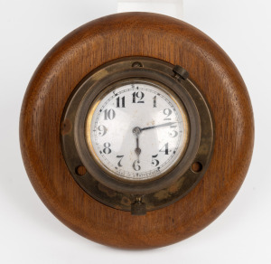 A vintage German brass cased boat clock on timber mount, the clock 8cm diameter