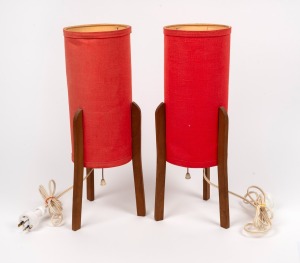 A pair of vintage teak table lamps with original red cloth covered&nbsp;shades, circa 1970 40cm high