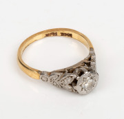 An 18ct yellow gold ring, set with a white diamond, mounted in platinum, stamped "18ct, PLAT.", ​​​​​​​2.9 grams