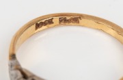 An 18ct yellow gold ring, set with a white diamond, mounted in platinum, stamped "18ct, PLAT.", ​​​​​​​2.9 grams - 3