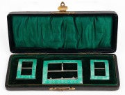 A set of three antique sterling silver and green enamel shoe and belt buckles, housed in original plush fitted case, ​​​​​​​the case 15.5cm wide.