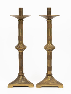 A pair of vintage brass candlesticks with tri-form bases, 20th century, 49cm high