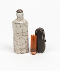 An antique Chinese scent bottle with silver top; together with a 9ct gold and amber cigar holder in original leather case, (2 items), the bottle 10cm high