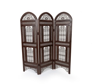 A Sheesham&nbsp;room divider with iron panels, most likely Indian,&nbsp;early 20th century, later brown painted finish, 185cm high, 174cm wide
