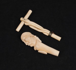 Two antique carved ivory parasol handles, 19th century, 14.5cm and 12.5cm high
