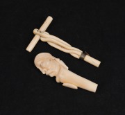 Two antique carved ivory parasol handles, 19th century, 14.5cm and 12.5cm high