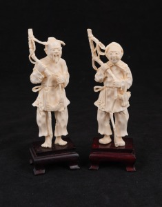 A pair of Japanese carved ivory peasant figures mounted on timber bases, early to mid 20th century, the larger 16cm high