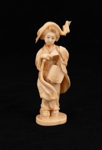 An antique Japanese carved ivory figure of a Geisha with musical instrument, Meiji period, 19th/20th century, 13cm high