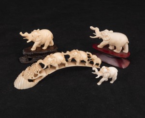A Chinese carved hippopotamus tooth bridge; together with three assorted carved ivory elephants (two on wooden stands), early to mid 20th century, (4 items), ​​​​​​​the bridge 13cm long