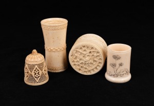 Four assorted carved ivory artefacts comprising of a dice cup, Chinese jewellery box (missing base), cylindrical vessel (missing base) and a pierced bell shaped cover, A/F, 19th/20th century, the largest 8.5cm high