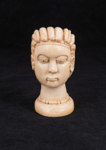 An African carved ivory head, early to mid 20th century, 12cm high