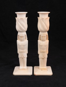 A pair of Egyptian revival carved ivory candlesticks, early to mid 20th century, 22.5cm high