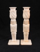 A pair of Egyptian revival carved ivory candlesticks, early to mid 20th century, 22.5cm high