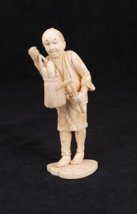 An antique Japanese carved marine ivory okimono of a farmer, Meiji Period, 19th/20th century, 15.5cm high