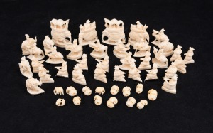 Indian carved ivory chest pieces and assorted elephant beads, (qty), the largest 5cm high