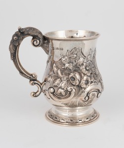 An antique English sterling silver pint tankard with floral repousse decoration, made in London, circa 1863, 15cm high, 372 grams