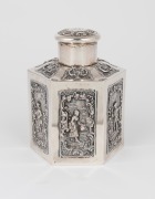 An antique English sterling silver hexagonal tea caddy adorned with repousse vignettes and engraved ownership monogram dated 1892, 12cm high, 209 grams