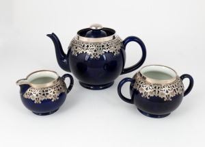 ROYAL DOULTON antique English three piece blue porcelain tea service with ornate applied silver decoration, 19th century, factory mark to base, the teapot 13cm high
