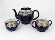 ROYAL DOULTON antique English three piece blue porcelain tea service with ornate applied silver decoration, 19th century, factory mark to base, the teapot 13cm high