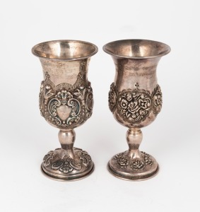 Two sterling silver goblets with Hebrew inscriptions (one for a barmitzvah boy and one commemorative), one stamped "STG. SIL" and the other "925", 14cm high, 238 grams total