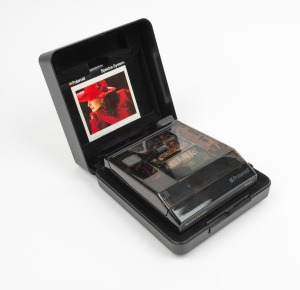 POLAROID: Transparent-body Spectra Onyx instant camera, c. 1987, in plastic case with instruction booklet and strap.