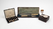 Boxed silver cake forks retailed by Flavelle Brothers and Sankey Ltd.; together with a sterling silver travelling cup and cover in original fitted box plus a box set of antique silver plated fish servers, 19th/20th century, (3 items)