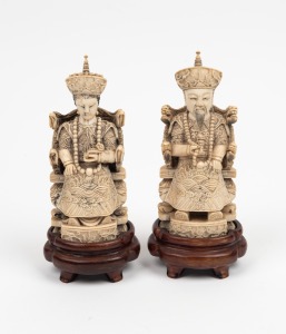 A pair of Chinese carved ivory ancestor figures on wooden bases, 19th/20th century, ​​​​​​​16.5cm each overall
