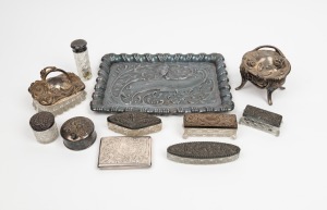 138 · An antique sterling silver pocket purse with brown leather and ivory interior, together with a silver plated Art Nouveau tray, silver plated trinket boxes and vanity jars, 19th/20th century, (11 items), the tray 31cm wide.