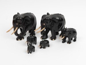 Six assorted carved ebony and bone elephants, early to mid 20th century, the largest 15cm high.