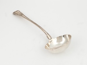 A Georgian sterling silver soup ladle with shell decoration and engraved family crest, made in London, circa 1816, 33cm long, 280 grams
