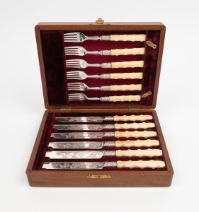 Antique silver fruit cutlery set with carved ivory handles, housed in original plush fitted walnut canteen, 19th century, the canteen 24cm wide