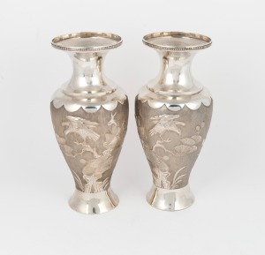 37 · A pair of antique Japanese export silver vases with vacant shields and repousse eagle and chrysanthemum decoration, 19th/20th century, seal mark to base, 22cm high, 590 grams
