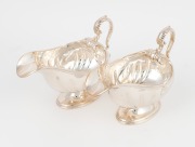 A pair of antique English sterling silver sauce boats by Atkin Brothers of Sheffield, circa 1905, 14cm high, 18cm long, 725 grams total